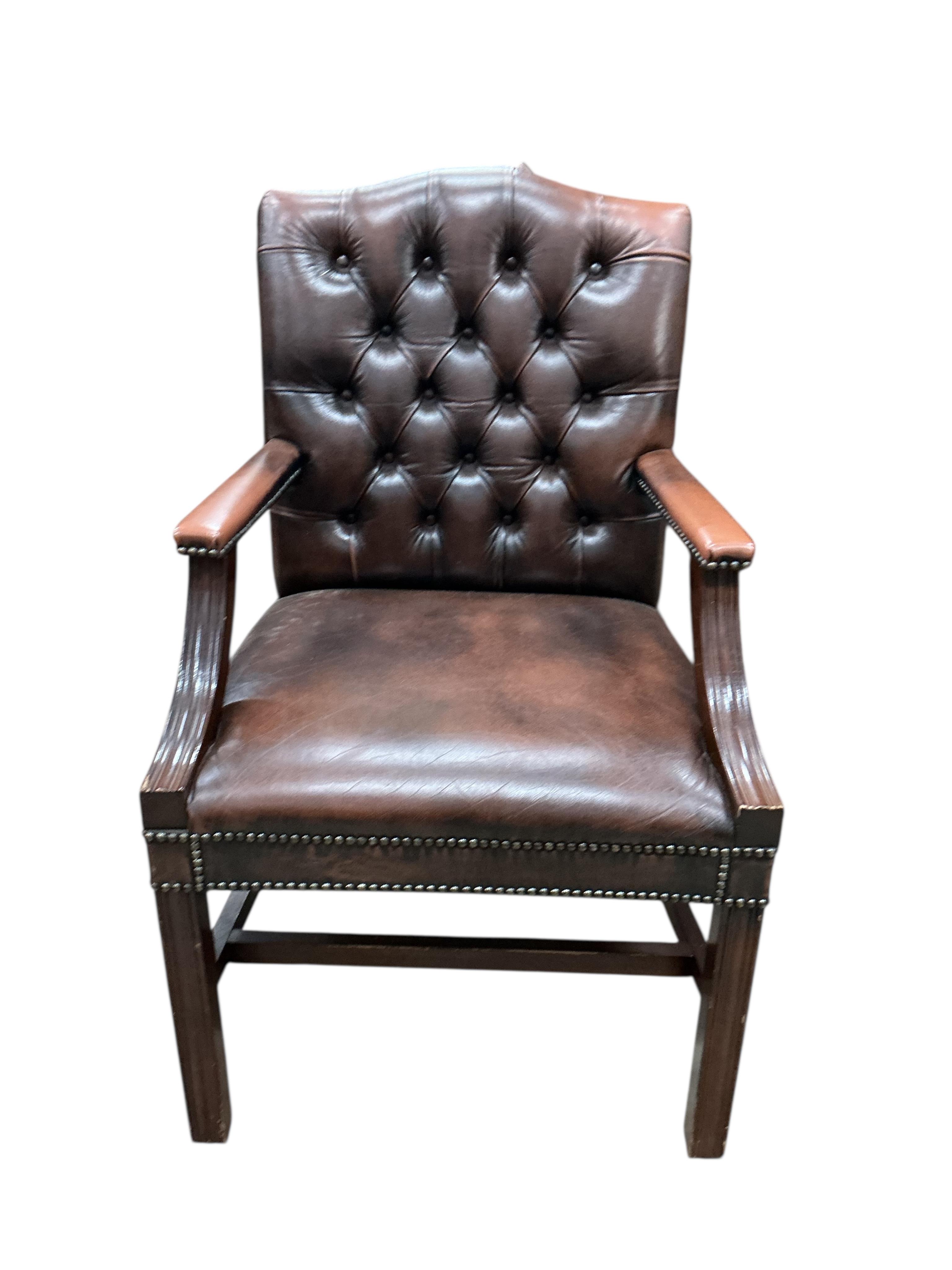 Three George III style button brown leather mahogany Gainsborough type chairs, width 62cm, depth 52cm, height 98cm